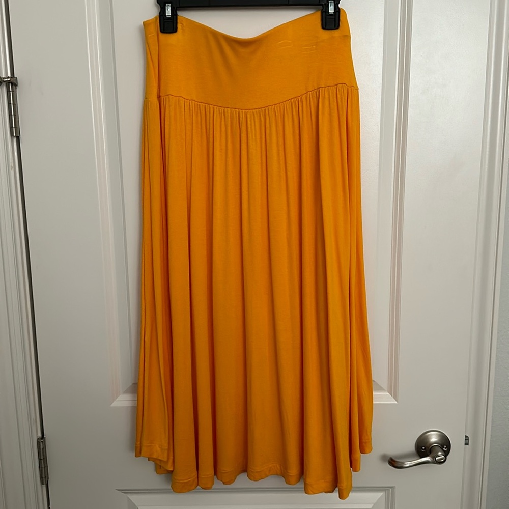 Loft gold rayon/ spandex long skirt. Size medium.